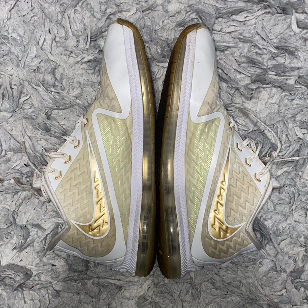 Gold & white Nike running shoes